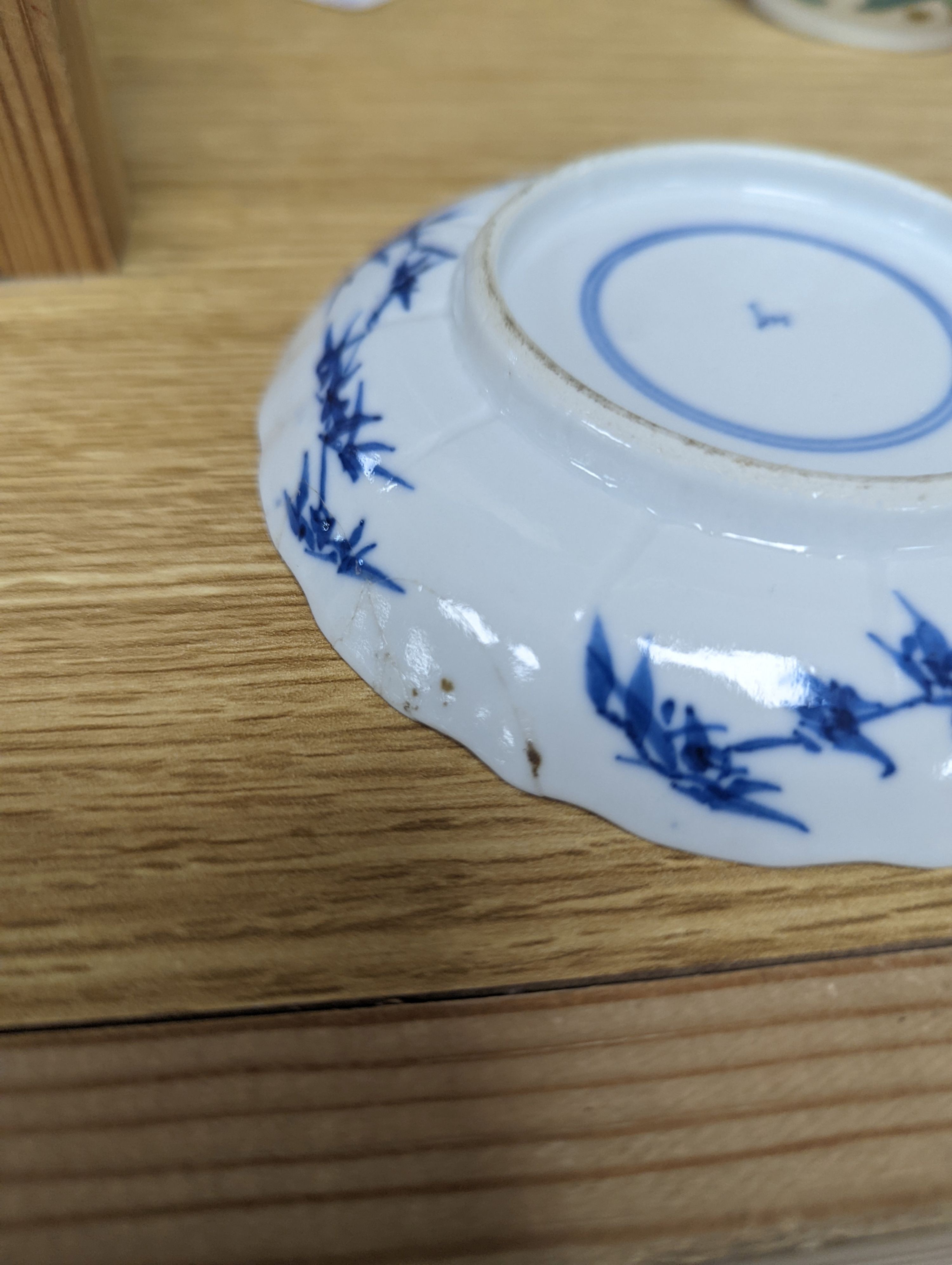Two Chinese porcelain saucers, and a Chinese enamelled porcelain vase, 12.5cm., 18th century and later